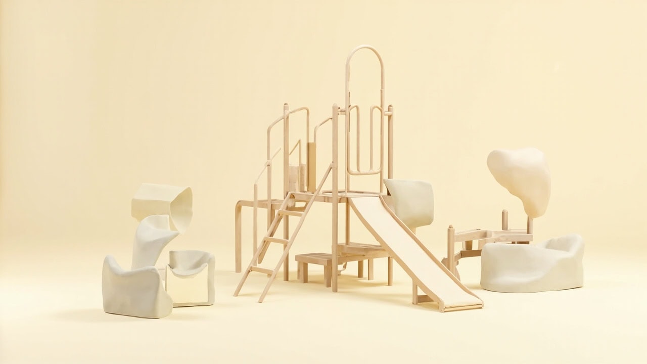 An unoccupied clay-style playground model with a pale wooden climbing frame, steps, slide and rounded play pods on ivory.