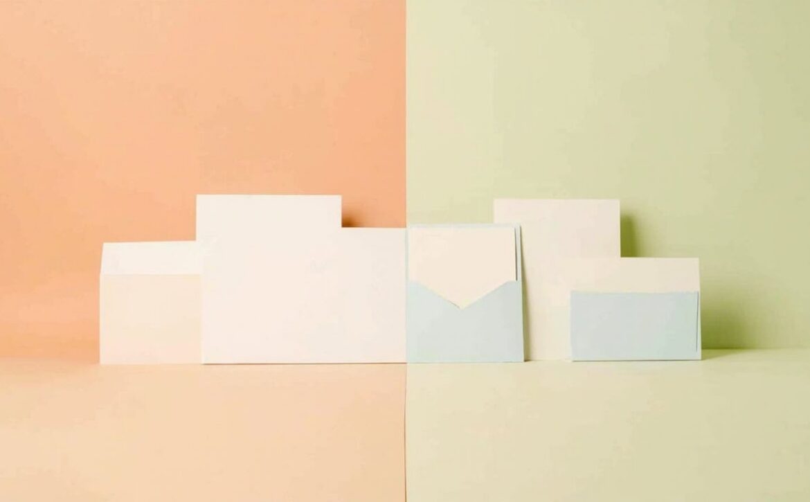 Abstract blank white and pale-blue document-like panels arranged across a peach-and-sage split backdrop.