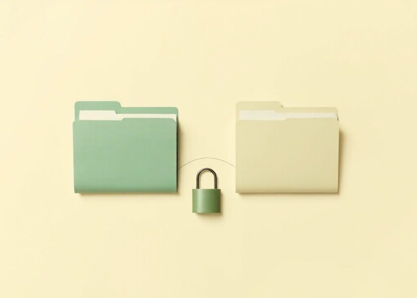 Two plain folders linked by a dotted line, with a small closed padlock between them on an ivory background.